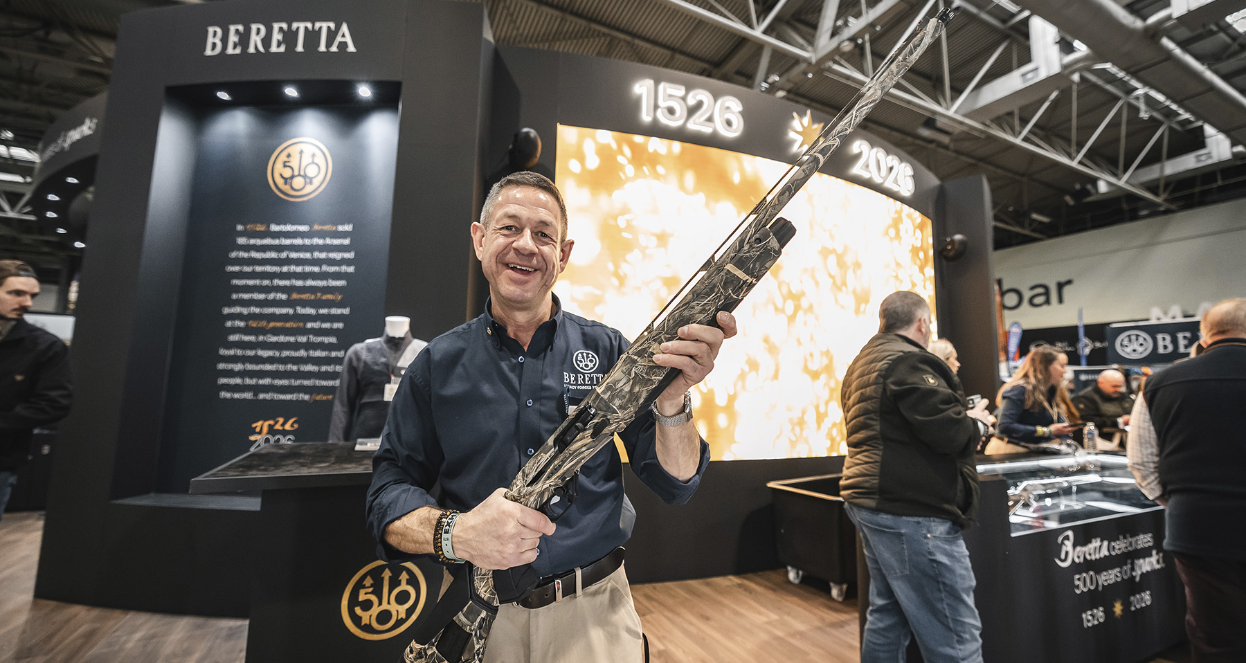 Visitors crowded around the Beretta 500th anniversary stand at the Great British Shooting Show