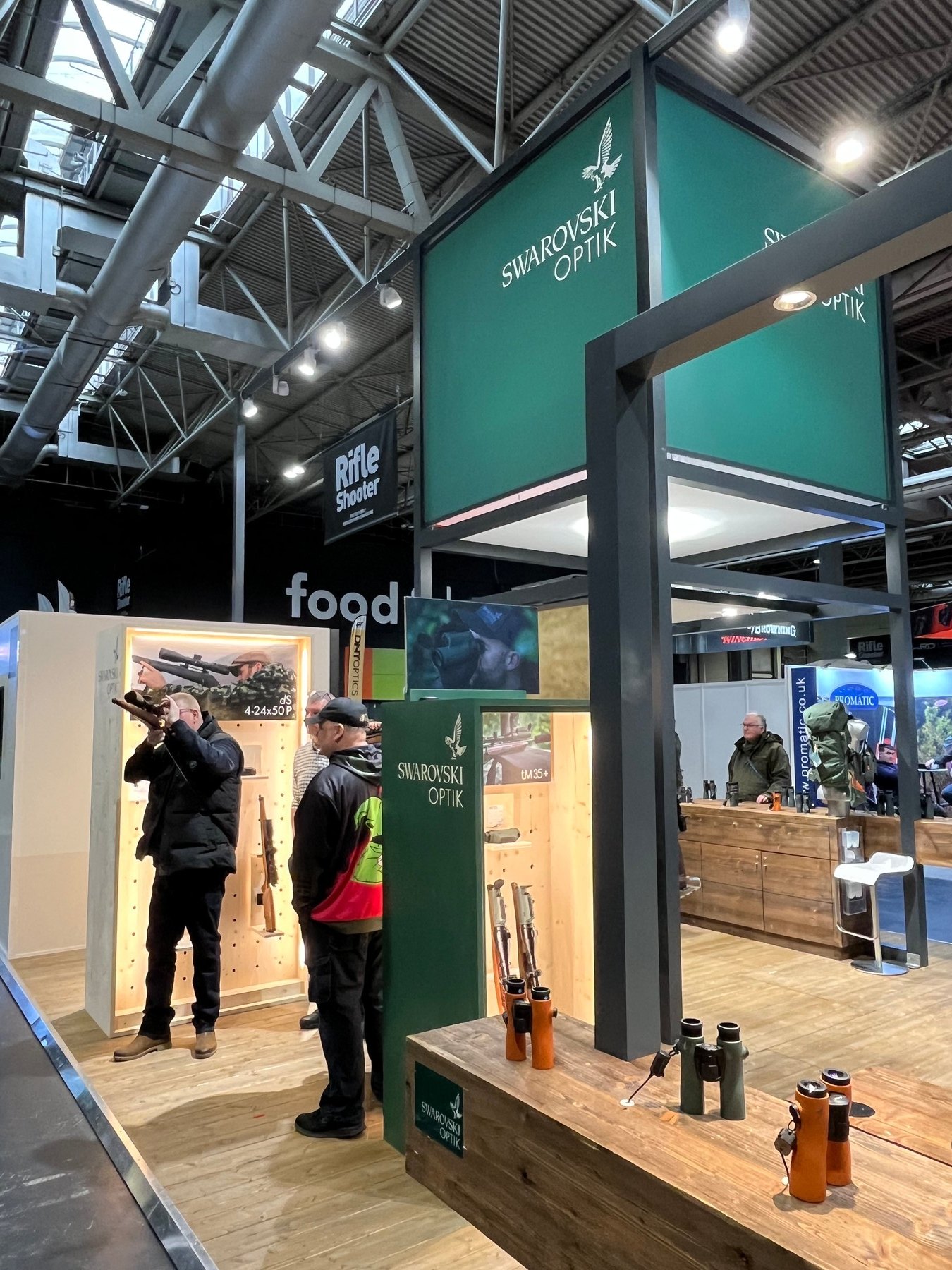 The Swarovski Optik stand at the British Shooting Show, with binoculars and spotting scopes out on the counter