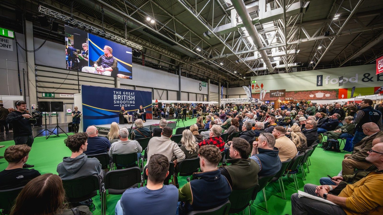 A packed audience at the main stage of the Great British Shooting Show at the NEC Birmingham