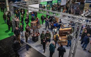 Visitors handling rifles on the Blaser stand at the British Shooting Show at the NEC Birmingham
